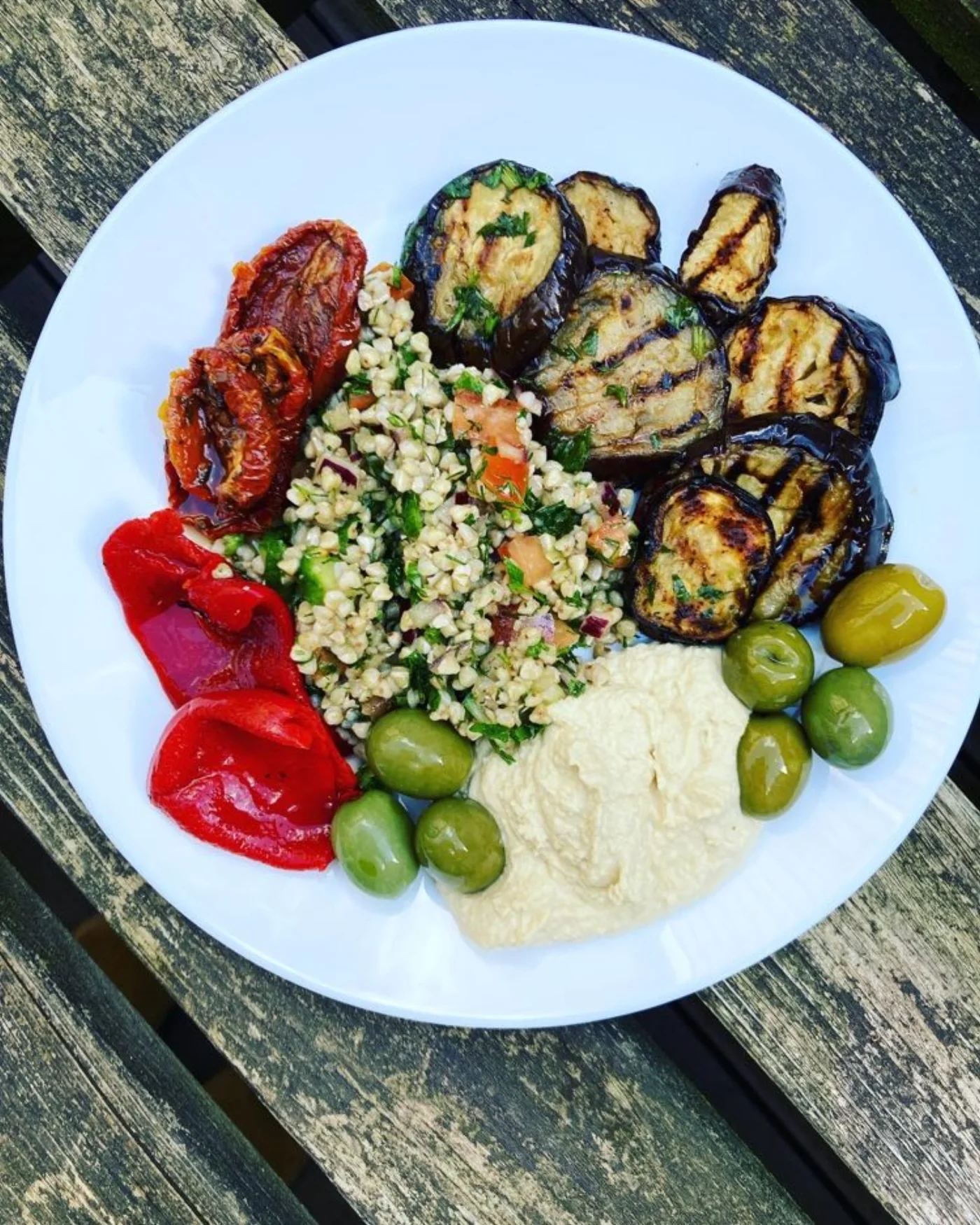 A colourful Kinship Kitchen catering table with fresh dishes